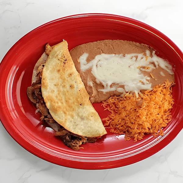El Mezcal Grill's quesadilla with rice and refried beans on a red plate.